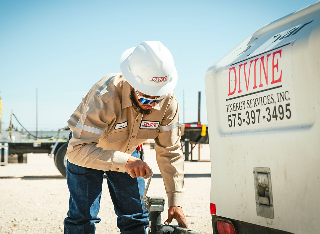 Careers at Divine Energy - Employee Operating a Light Tower